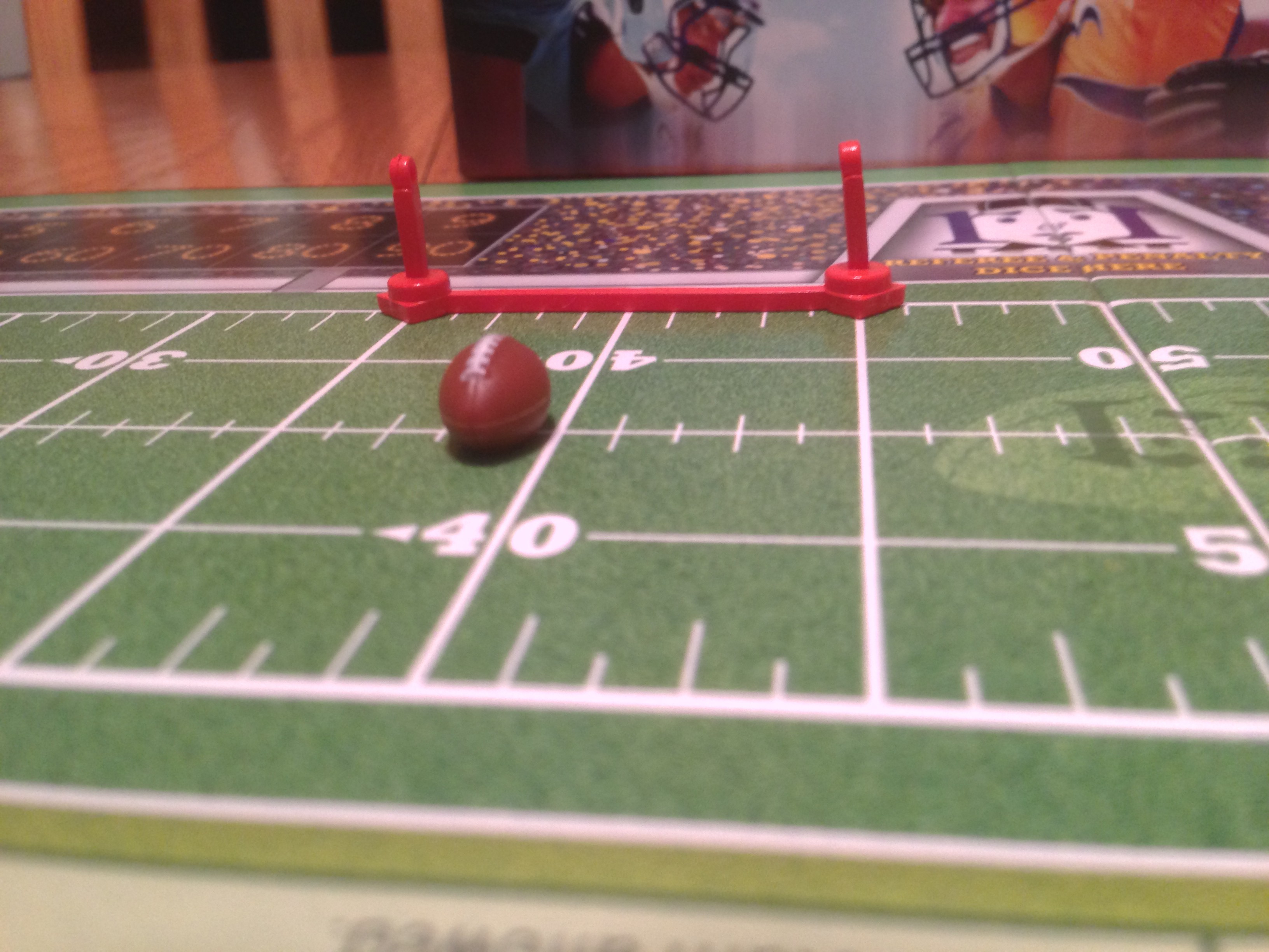 Closeup of football and down markers